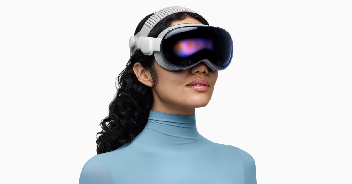 A woman wearing an Apple Vision Pro headset