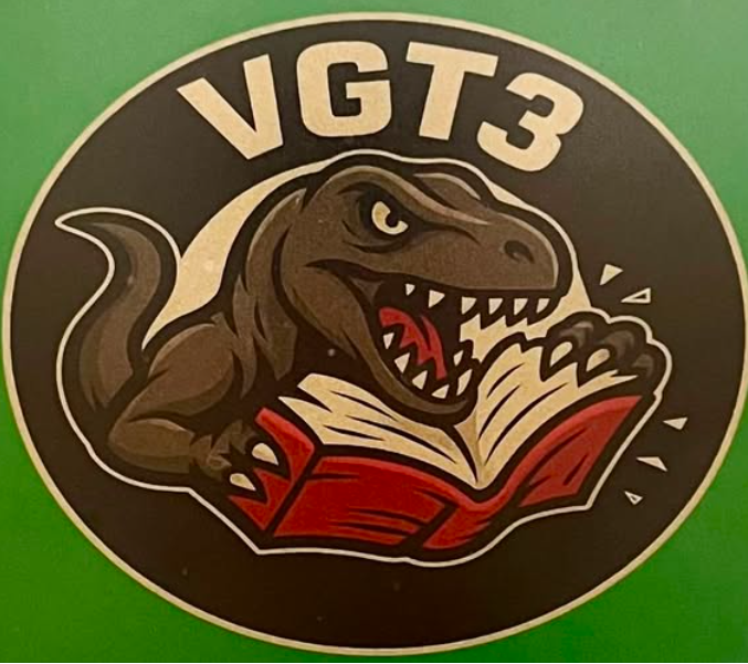 The VGT3 team logo shows a Tyrannosaurus rex biting into a book